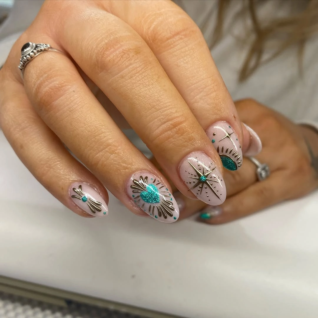 trendy fall nails for olive skin tone 2026 teal gold starburst nail art