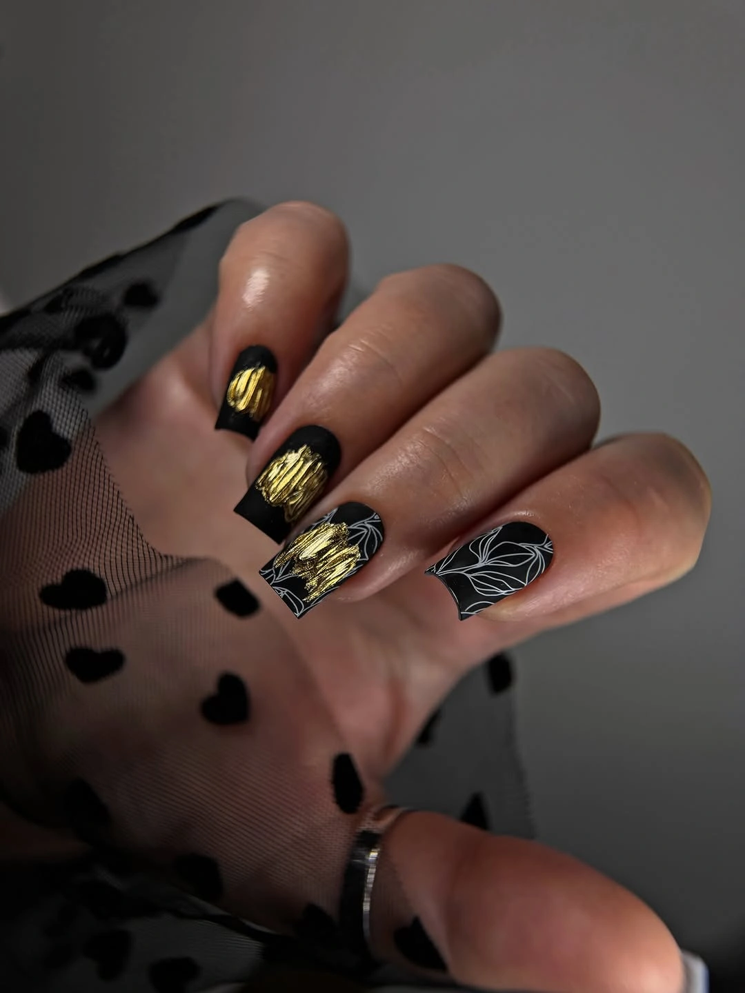 trendy matte fall nails design 2026 Black Matte Nails With Gold Botanical Details