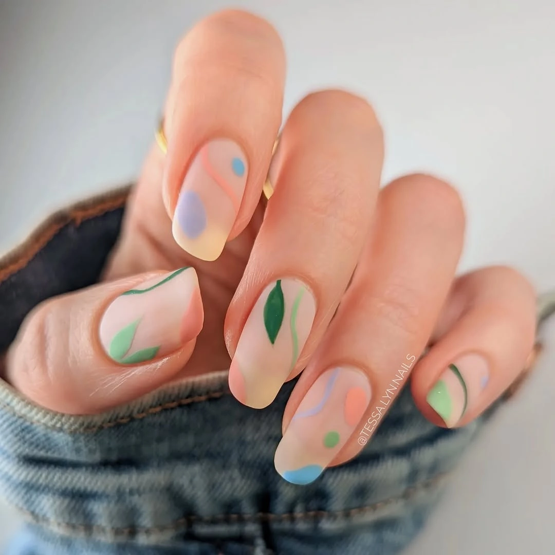 trendy matte fall nails design 2026 Soft Autumn Pastel Almond Nails With Playful Abstract Details