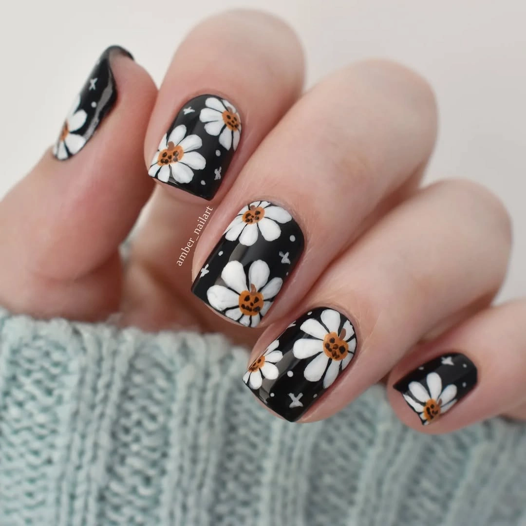 unique halloween nail art 2026 Black and White Pumpkin Flower Nails