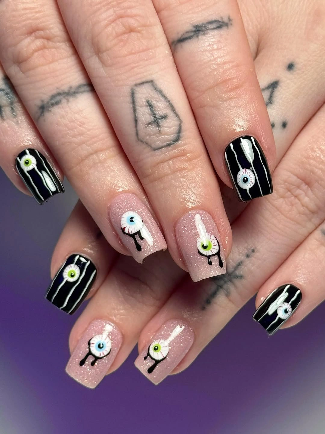 unique halloween nail art 2026 Spooky Eyeball Nails in Black White and Sheer Pink