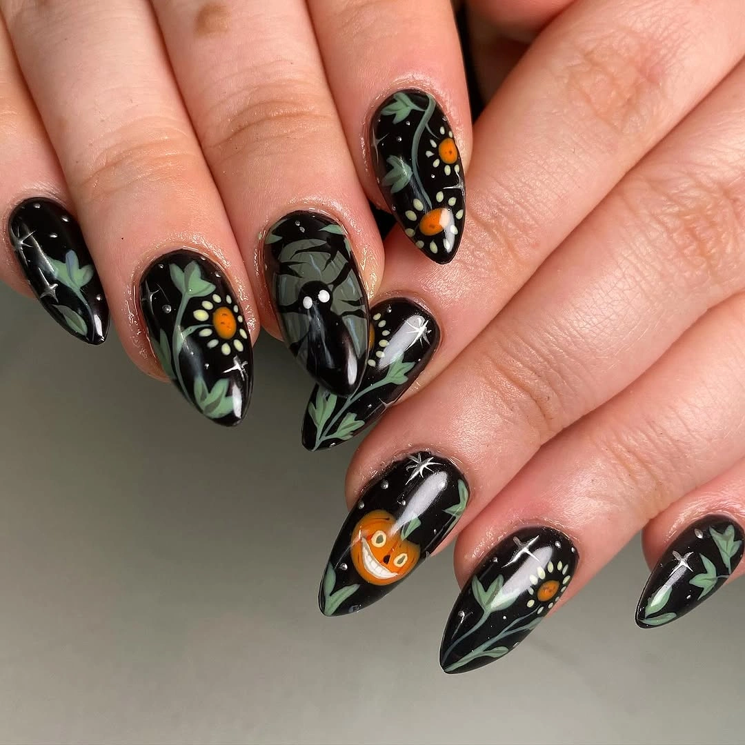 unique halloween nail art 2026 Black Floral Halloween Nails With Tiny Jack O Lanterns